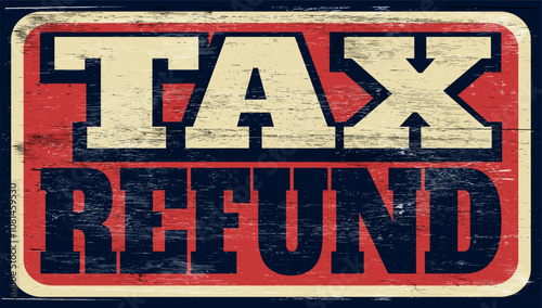 Aged and worn tax refund sign on wood