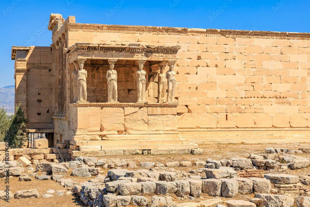 A large building with statues of women on the front, Acropolis in Athens A large building with statues of women on the front, Acropolis in Athens