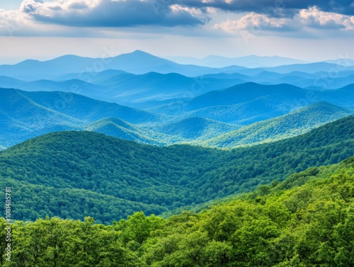 Serene mountain landscape with rolling hills and lush greenery under a cloudy sky.