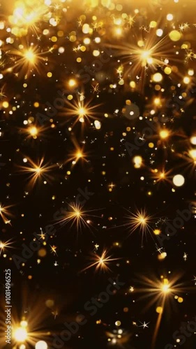 A dazzling display of golden stars and bokeh effects on a dark background, creating a festive mood.