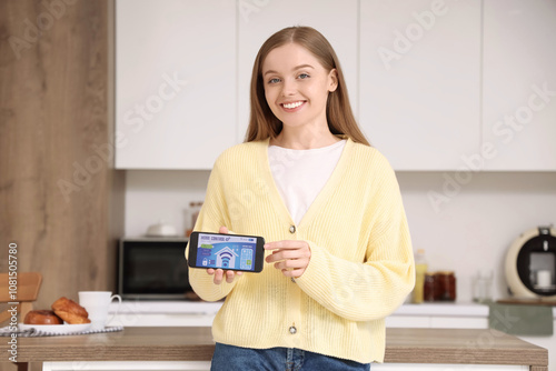 Smiling young woman holding...