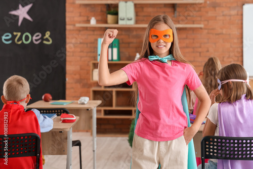 Teenage girl dressed as superhero in classroom