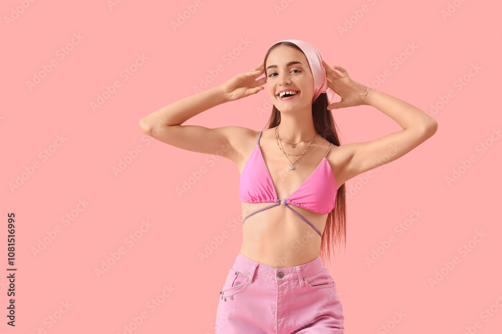 Portrait of fashionable young woman on pink background Portrait of fashionable young woman on pink background