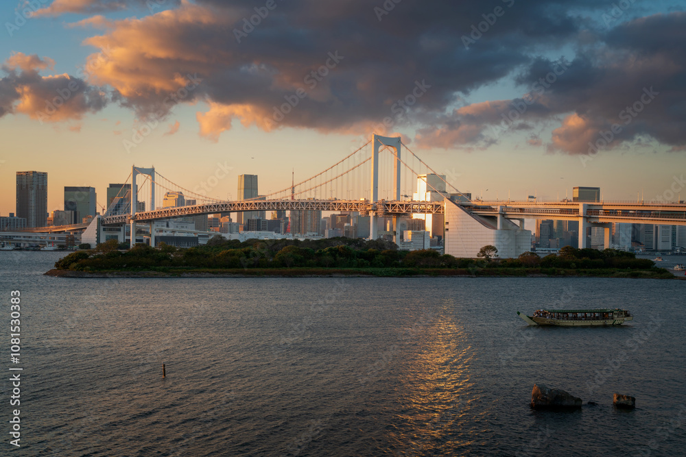 View of the automobile suspension Bridge over the North Tokyo Bay Rainbow Bridge from Odaiba Island at sunset, Tokyo, Japan View of the automobile suspension Bridge over the North Tokyo Bay Rainbow Bridge from Odaiba Island at sunset, Tokyo, Japan