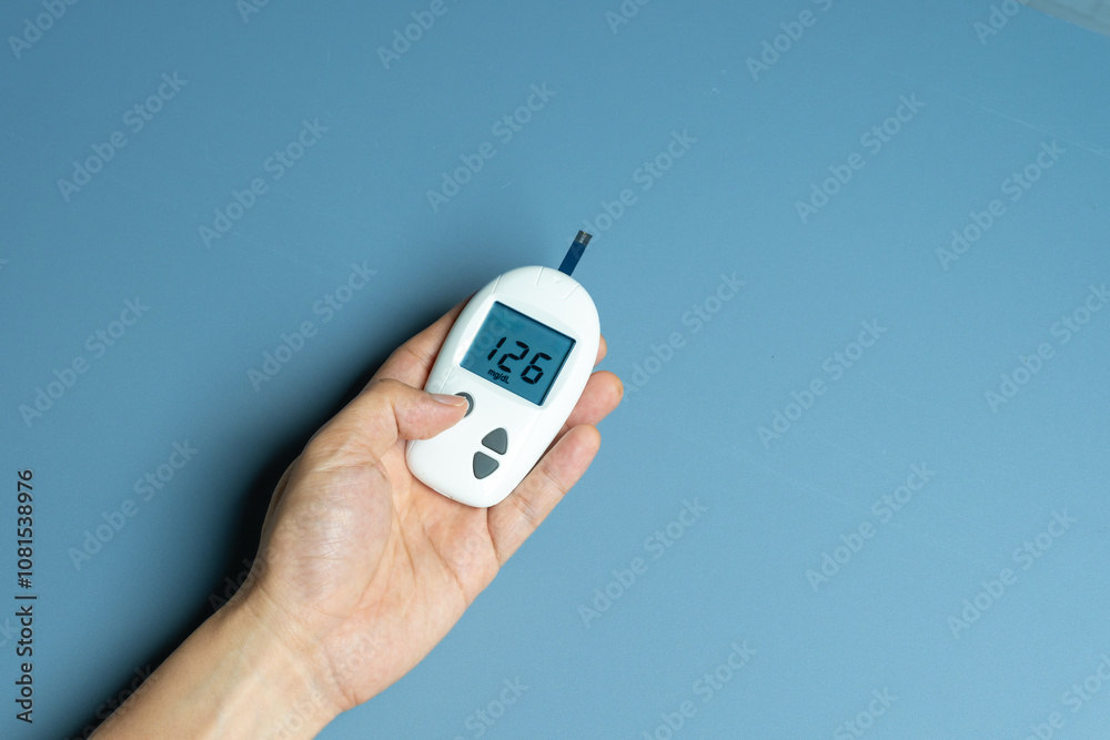 hand of woman check diabetes and high blood glucose monitor with digital pressure gauge. Healthcare and Medical concept
hand of woman check diabetes and high blood glucose monitor with digital pressure gauge. Healthcare and Medical concept
