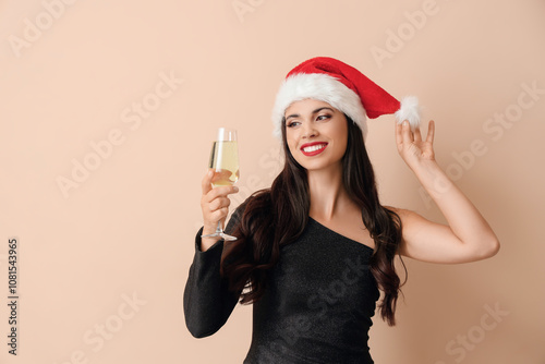 Festive woman in santa hat ...
