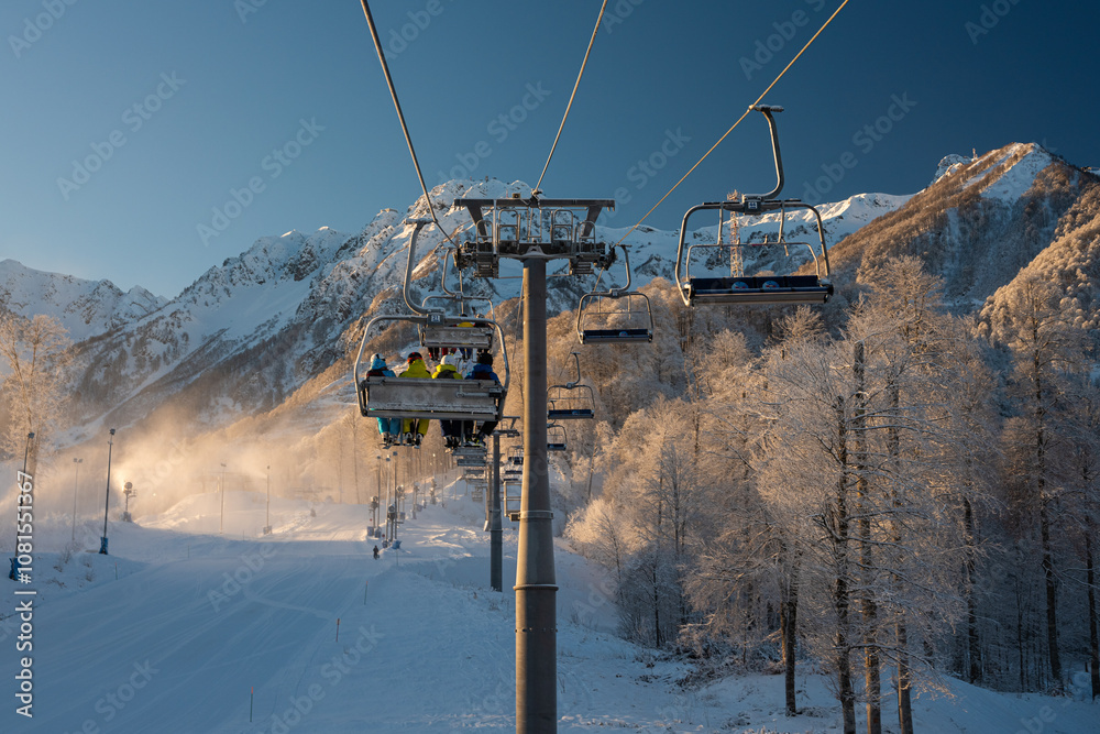 Skiers on chairlift at Rosa Khutor ski resort Skiers on chairlift at Rosa Khutor ski resort