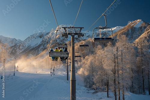 Obraz na plátně Skiers on chairlift at Rosa Khutor ski resort