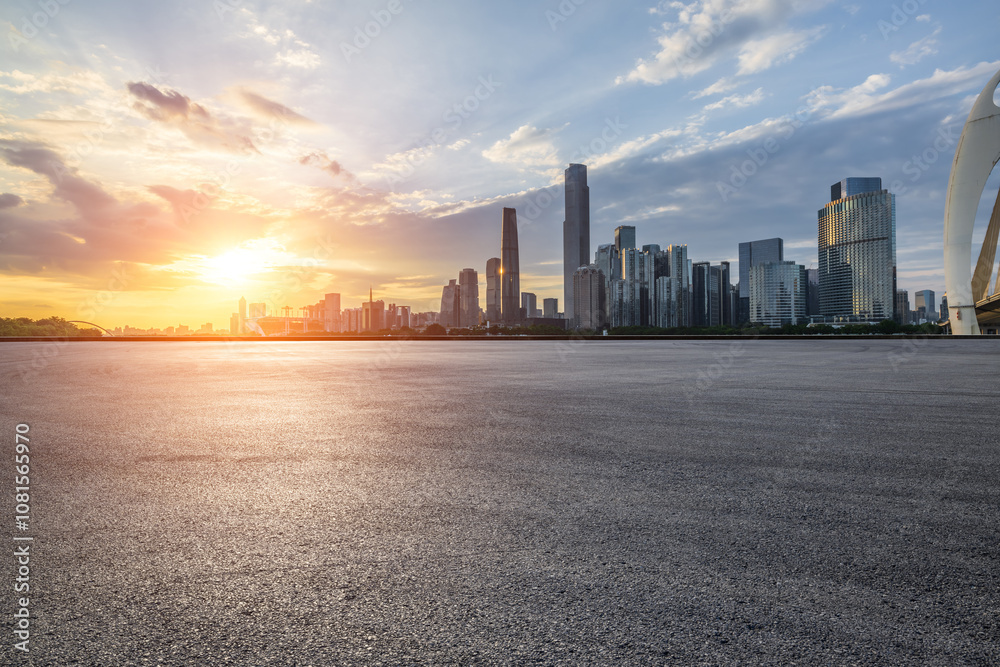 Asphalt road square and city skyline with modern buildings scenery at sunset in Guangzhou. car advertising background. Asphalt road square and city skyline with modern buildings scenery at sunset in Guangzhou. car advertising background.