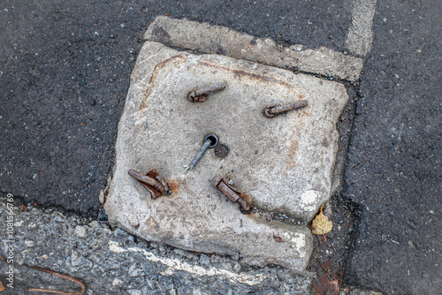 The foundation of the mast of street lighting on an autumn day photo