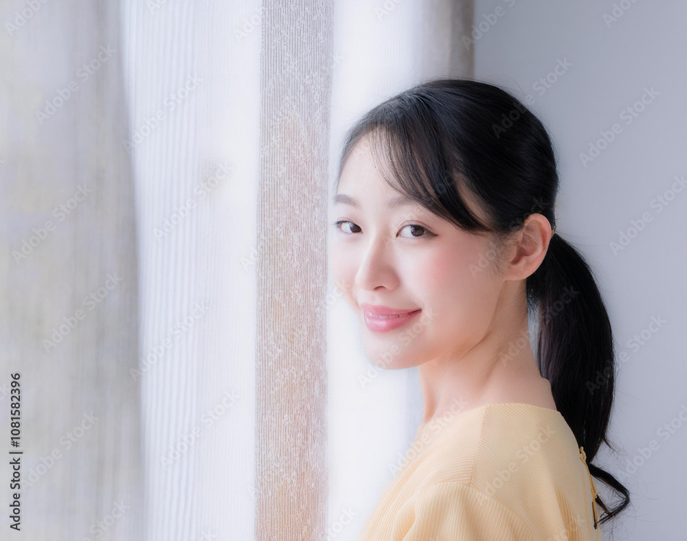 Elegant and timeless: a Japanese model showcases modern fashion against a white backdrop. Elegant and timeless: a Japanese model showcases modern fashion against a white backdrop.