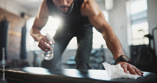 Foto Man, hands and spraying with bottle on gym bench for hygiene, disinfection or sanitary equipment