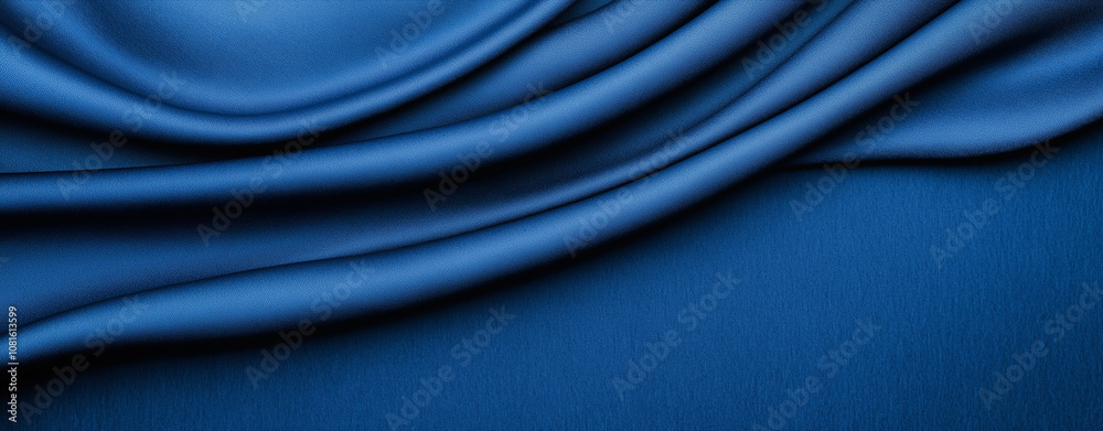 Obraz premium A rich deep blue textured background with a weathered effect. The image features varying shades of navy and electric blue ,dimension, silk,satin, fabric . 