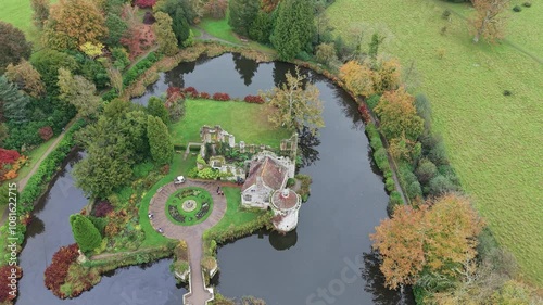 Scotney castle aerial view looking down over mansion moat and seasonal autumn national trust gardens photo