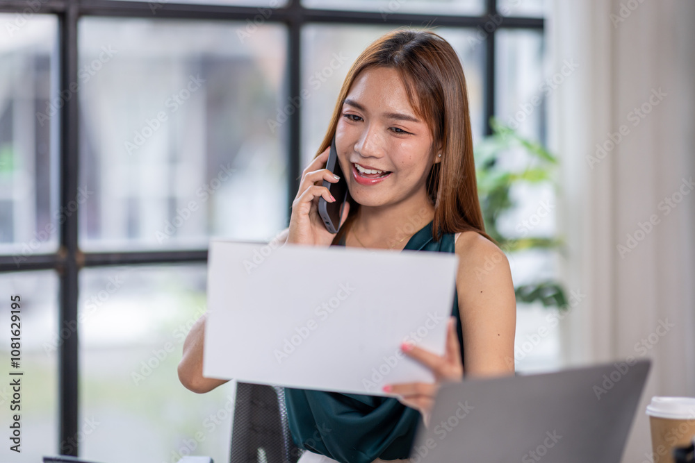 Young adult caucasian woman having a phone call at work, Beautiful girl at work looking worried while receiving bad tragic a news via phone, Female using phone receiving report at office in day. Young adult caucasian woman having a phone call at work, Beautiful girl at work looking worried while receiving bad tragic a news via phone, Female using phone receiving report at office in day.
