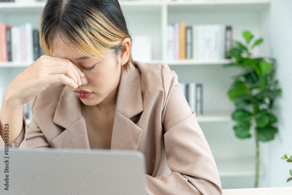 Headache, female having migraine pain, bad health, Asian woman feeling stress and headache, Office syndrome, sad tired touching forehead having migraine or depression, irritated girl, sadness grief Headache, female having migraine pain, bad health, Asian woman feeling stress and headache, Office syndrome, sad tired touching forehead having migraine or depression, irritated girl, sadness grief
