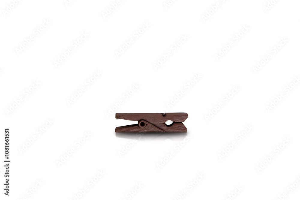 Brown stationery wooden clothespin isolated on white background with reflection and shadow Brown stationery wooden clothespin isolated on white background with reflection and shadow