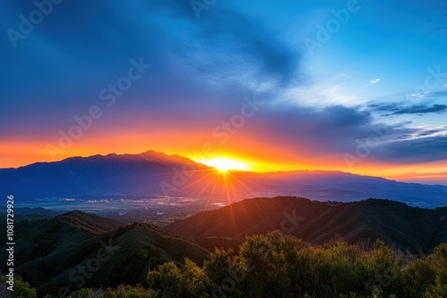 Breathtaking sunset over the mountains with vibrant colors and sunbeams