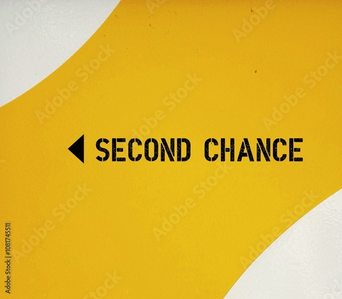 Yellow wall with direction sign SECOND CHANCE -  chance to try something again after failing once in relationship, society or professional life - based on belief people can learn from mistakes photo