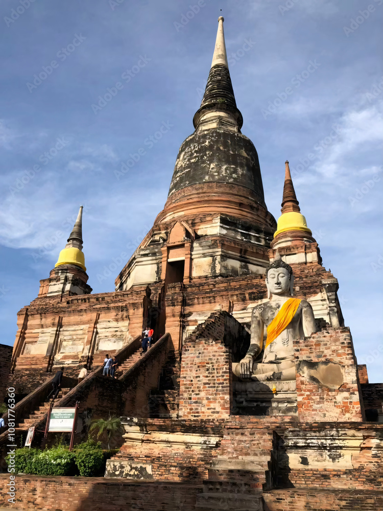 Fototapeta premium Ancient Buddhist Temple with Buddha Statue in Ayutthaya, Thailand.