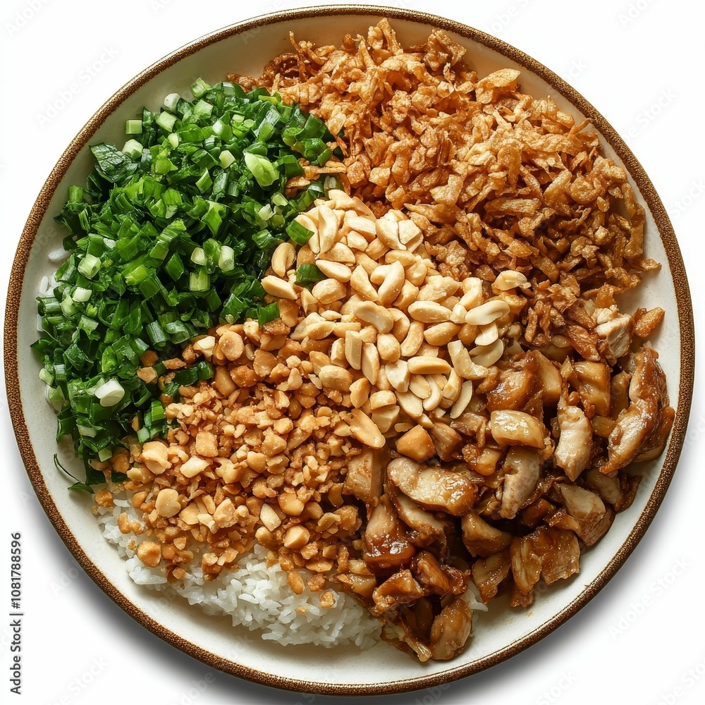 Rice bowl with chicken, peanuts, and green onions.