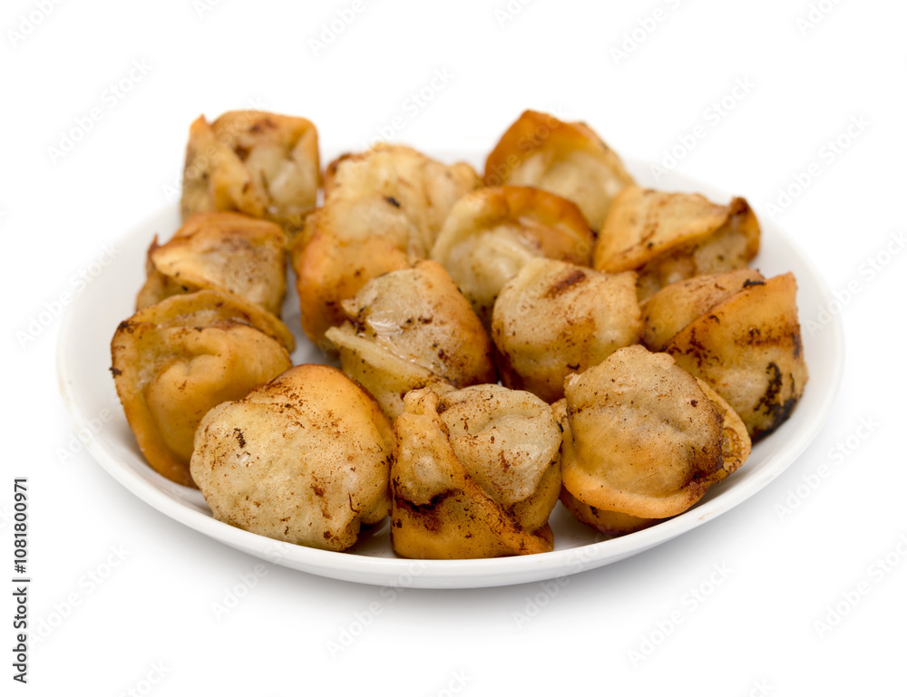 fried dumplings in a plate on a white background fried dumplings in a plate on a white background
