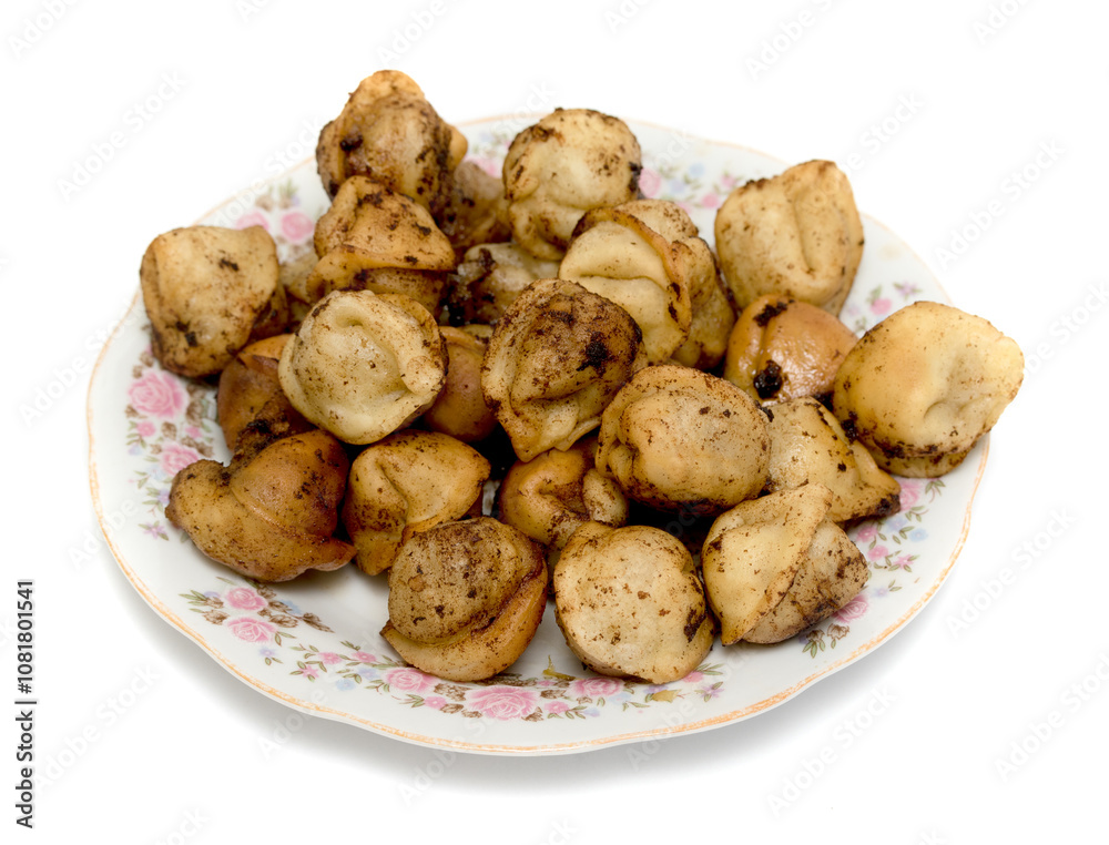 fried dumplings in a plate on a white background fried dumplings in a plate on a white background