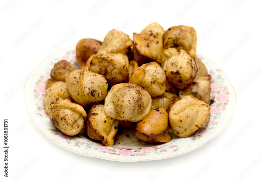 fried dumplings in a plate on a white background fried dumplings in a plate on a white background