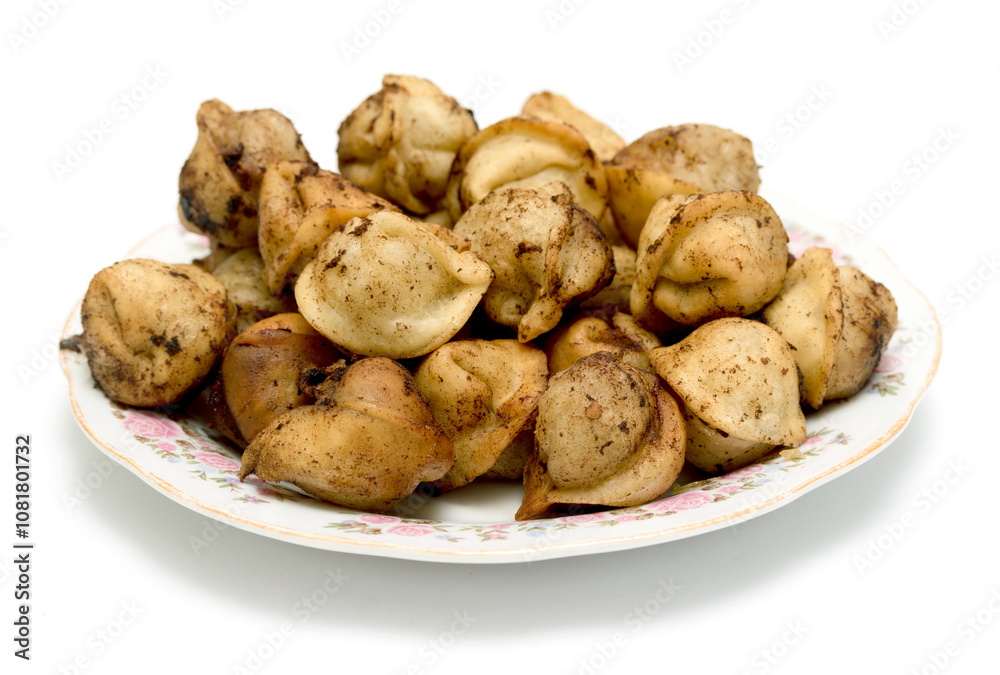 fried dumplings in a plate on a white background fried dumplings in a plate on a white background