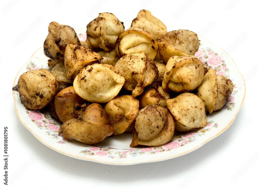 fried dumplings in a plate on a white background fried dumplings in a plate on a white background