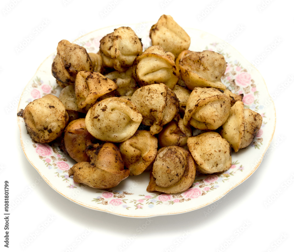 fried dumplings in a plate on a white background fried dumplings in a plate on a white background