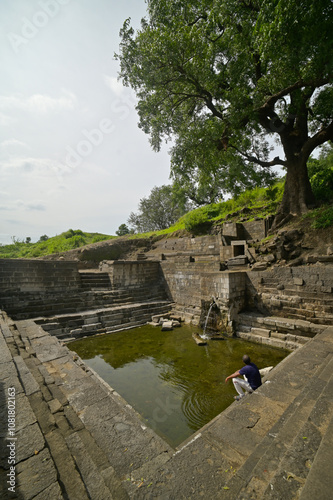 Ruins of ancient Stepwell built in stones with an eternal sweet water spring in the vicinity of Lonar crater lake, Buldhana, Maharashtra, India.