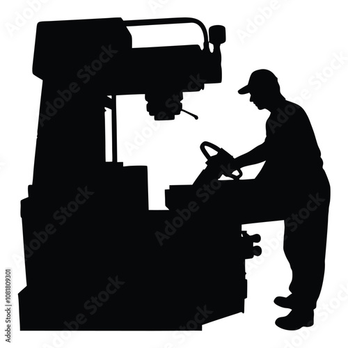 A man is working on a machine. The machine is black and has a large wheel. The man is wearing a hat