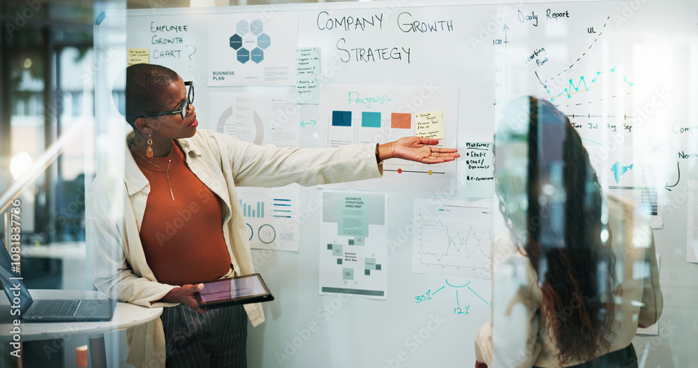 Obraz premium Business, women and meeting on whiteboard with statistics for strategy, report and planning as trend analyst. People, employees and teamwork or collaboration at office on company growth and insights