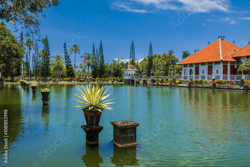 Water Palace Taman Ujung in Bali. Architecture with lake on sunny day photo