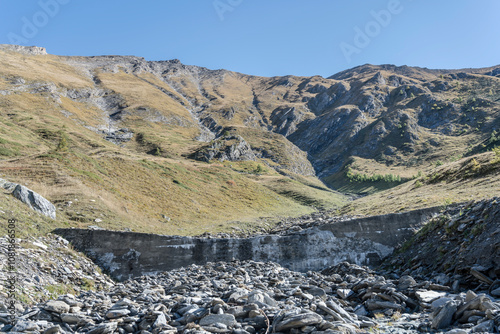 dry riverbed of little creek on Pelvo peak rugged slopes, near Finestre pass, Italy photo