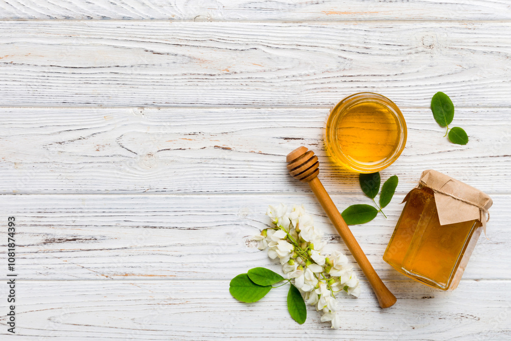 honey jar with acacia flowers and leaves. fresh honey top view flat lay honey jar with acacia flowers and leaves. fresh honey top view flat lay