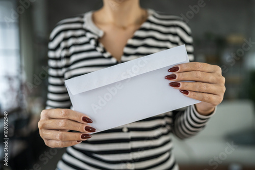 close up of woman hand receive letter, invitation or notification photo