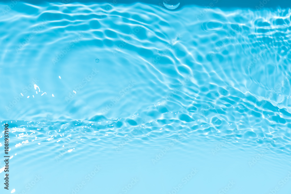 Blue water with ripples on the surface. Defocus blurred transparent blue colored clear calm water surface texture with splashes and bubbles. Water waves with shining pattern texture background. Blue water with ripples on the surface. Defocus blurred transparent blue colored clear calm water surface texture with splashes and bubbles. Water waves with shining pattern texture background.