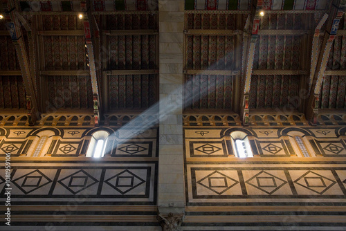 Interior of the medieval church of San Miniato in Florence with beam of light from the window (Tuscany-Florence-Italy) photo