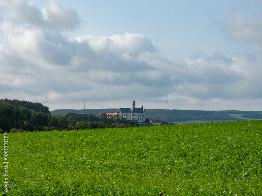 Neresheim, Germany - September 30th 2023: The famous monastery surrounded by hills and forests Neresheim, Germany - September 30th 2023: The famous monastery surrounded by hills and forests