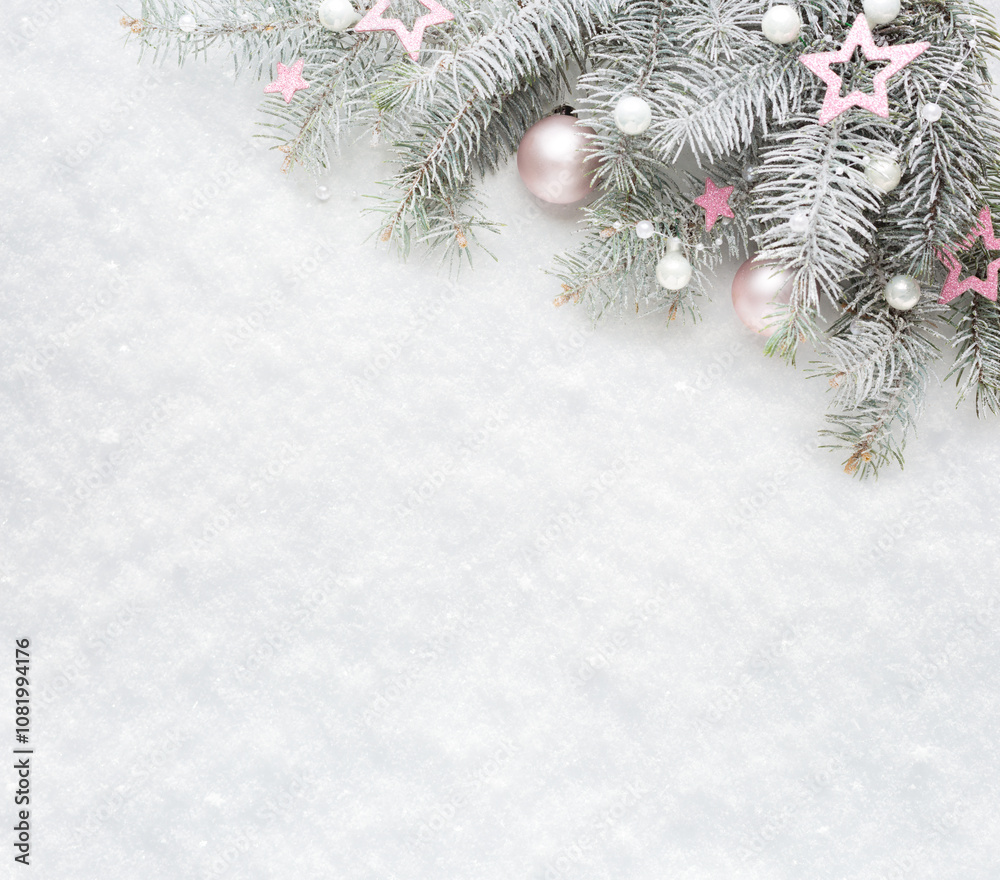 Christmas and New Year background. Christmas tree branches with decorations on the background of natural snow with empty space for text. Flat lay.