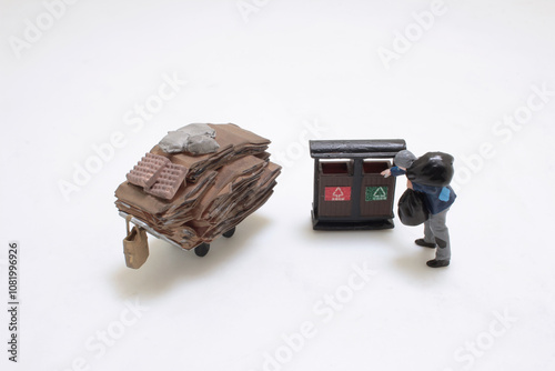 Miniature Figures Recycling and Collecting Cardboard Waste