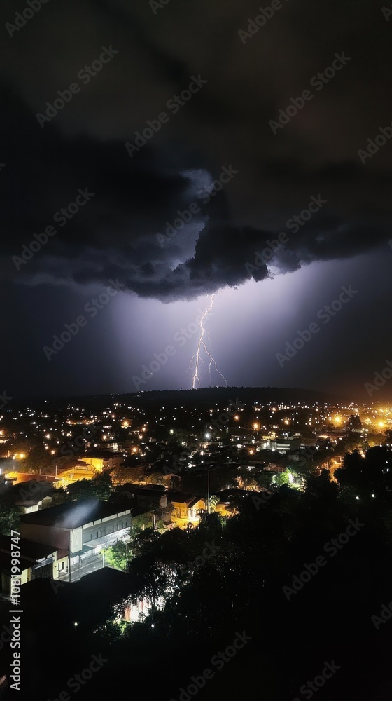 Fototapeta premium Lightning and rain storm with heavy rainfall and continuous lightning strikes lighting up the night