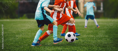 Boys Play Soccer Match on Green Grass. Running Youth Football Players. Kids Playing Football Soccer Game on Sports Field. Youth Soccer Tournament Teams Competition