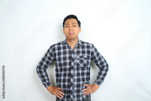 sad asian man crying isolated on white background, male wearing plaid shirt