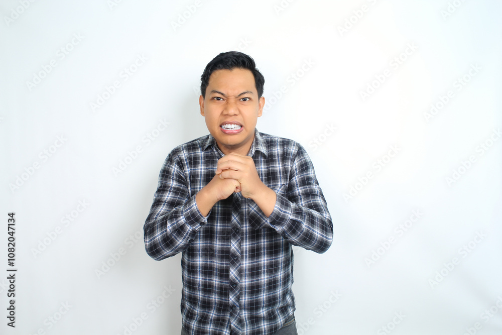 angry asian man pose fighting with arms raised wearing casual shirt isolated on white angry asian man pose fighting with arms raised wearing casual shirt isolated on white