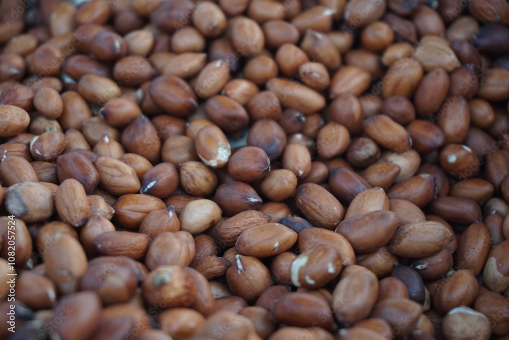 A heap of roasted peeled peanut on a street foodcart, Fresh roasted peanuts selling by a street vendor, A bunch of peeled peanuts. A heap of roasted peeled peanut on a street foodcart, Fresh roasted peanuts selling by a street vendor, A bunch of peeled peanuts.
