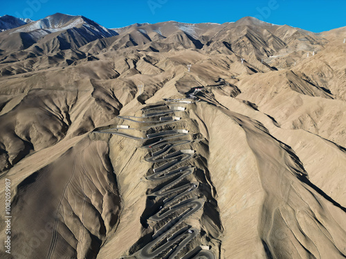 Canvas Print Scenic view of the winding hill road named Pan Long Ancient Road in Tashkurgan, Xinjiang, China
