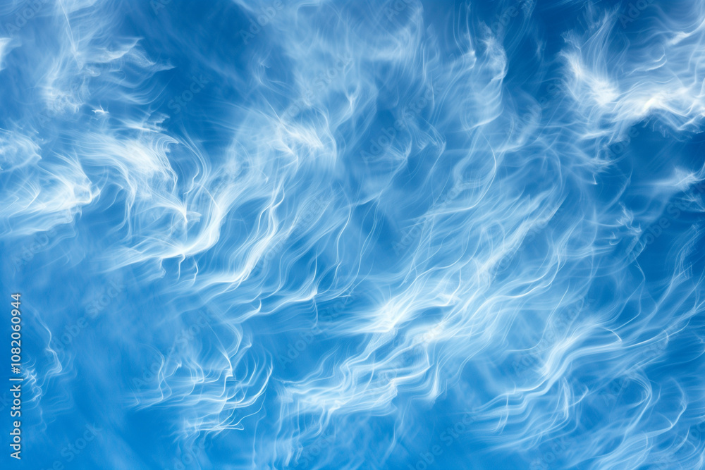 Wispy cirrus clouds stretching across a deep blue sky, creating delicate patterns. Wispy cirrus clouds stretching across a deep blue sky, creating delicate patterns.